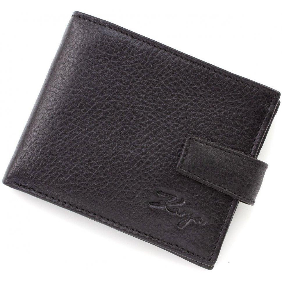 Karya Шкіряний чоловічий гаманець невеликого розміру в чорному кольорі з хлястиком на кнопці  (19996) - зображення 1