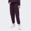 PUMA Сливові жіночі спортивнi штани  MOTION Pants FL 681684/44 M сливовий - зображення 1